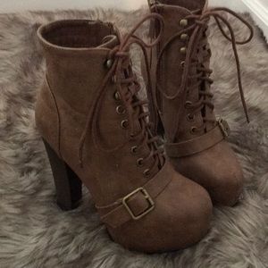 Brown heeled lace up boots
